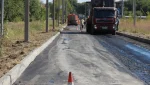 В пер. Спортивный укладывают выравнивающий слой асфальта
